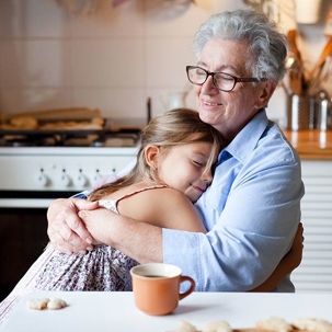 child hugging her grandmother